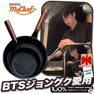 Two black iron frypans with wooden handles shown next to a person cooking on a stovetop.