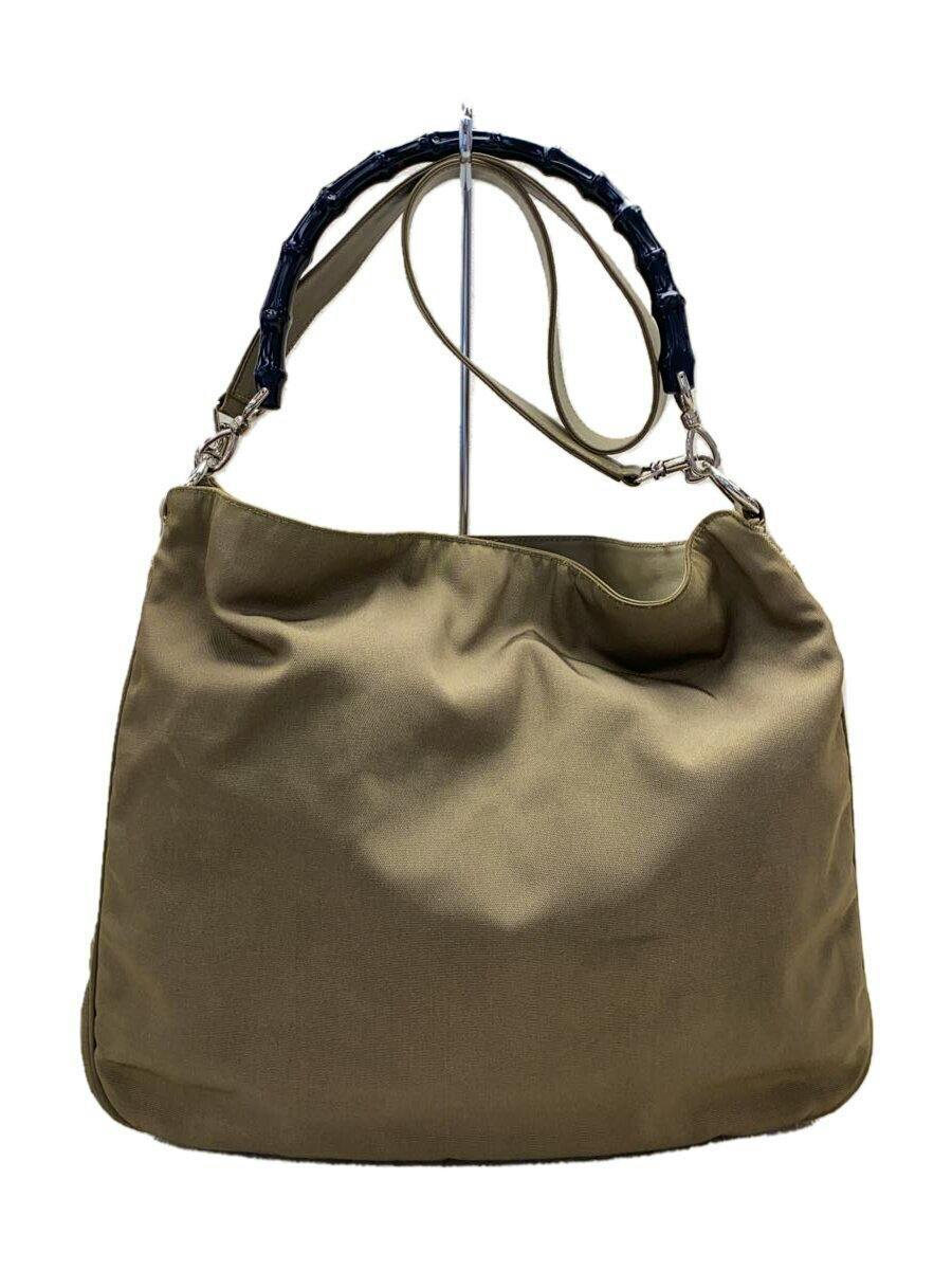 Khaki (KHK) polyester Gucci shoulder bag with a black bamboo top handle and a long detachable strap shown hanging.