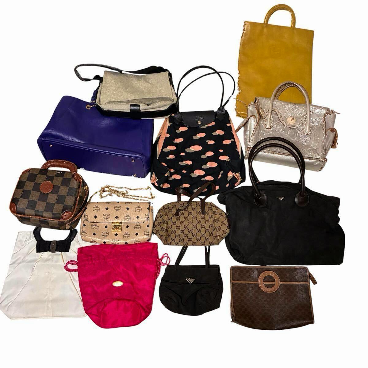 Thirteen assorted branded bags and pouches arranged on a white background, shown as a bulk set.