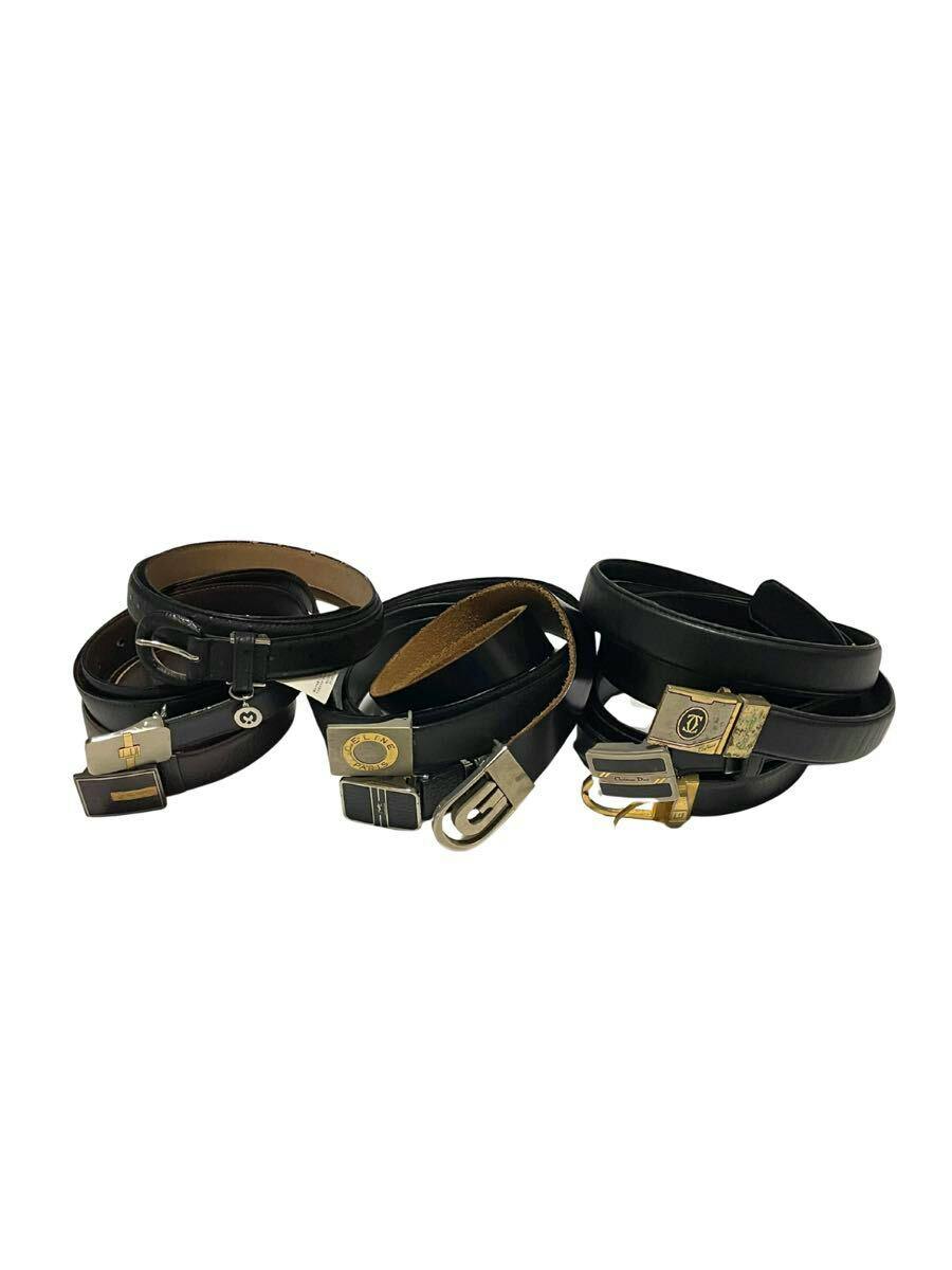 Multiple black leather straps and belts with various metal buckles arranged on a white background.
