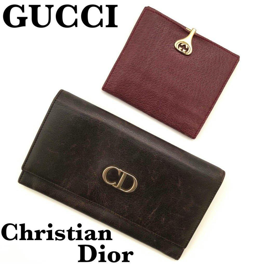 Two leather wallets on a white background: a dark brown Christian Dior long wallet with a CD logo and a wine-red Gucci bi-fold with a gold GG clasp.