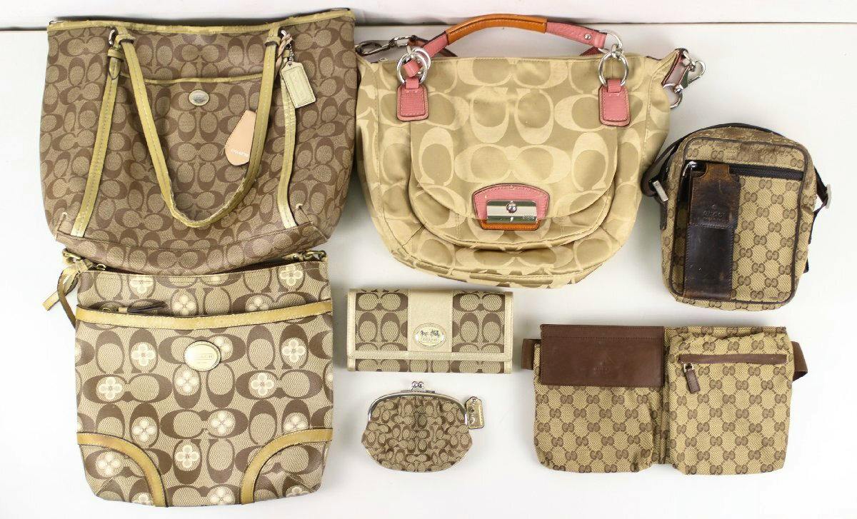 Top-down photo of seven bags and wallets (Coach and Gucci patterns) arranged on a white background.