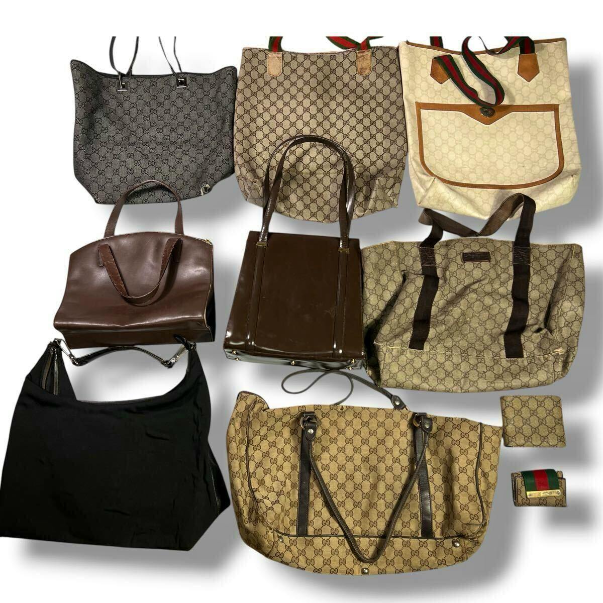 Multiple GUCCI tote and shoulder bags in GG canvas, plus wallets and a key case, arranged on a white background.
