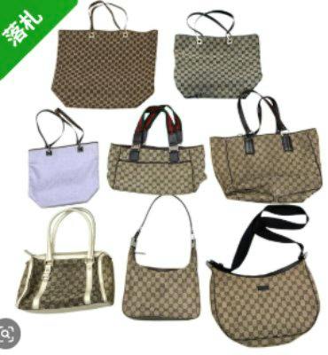 Eight Gucci GG canvas bags including totes, shoulder bags, and handbags arranged on a white background.