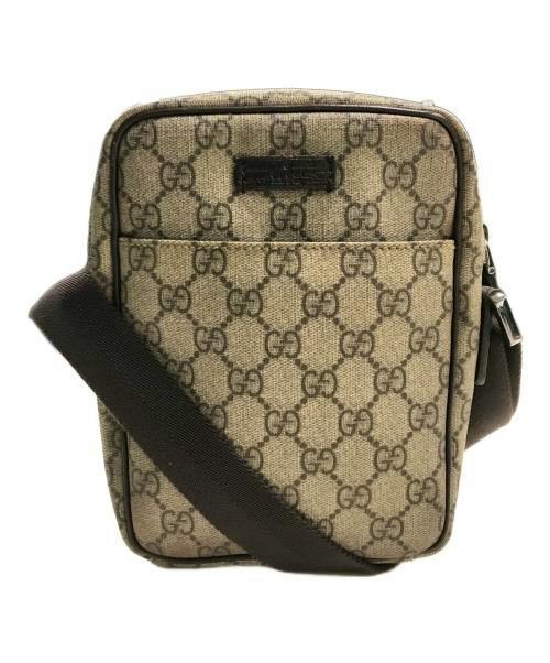 Front view of a GG Plus canvas shoulder bag with all-over GG monogram and a dark shoulder strap.