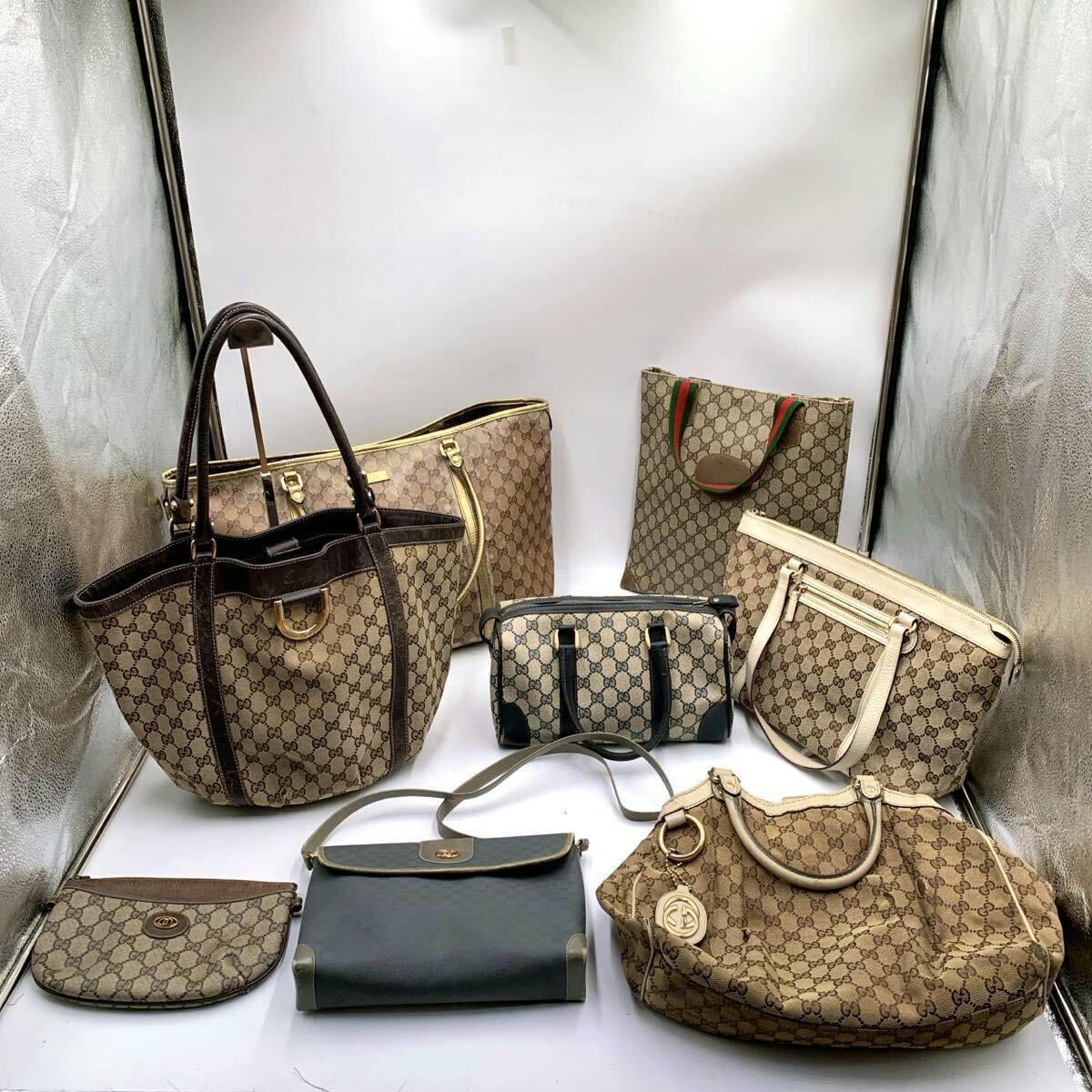 Eight GUCCI GG canvas bags and pouches with GG pattern arranged on a white background.