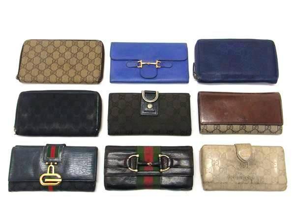 Nine GUCCI wallets and purses arranged in three rows on a white background.