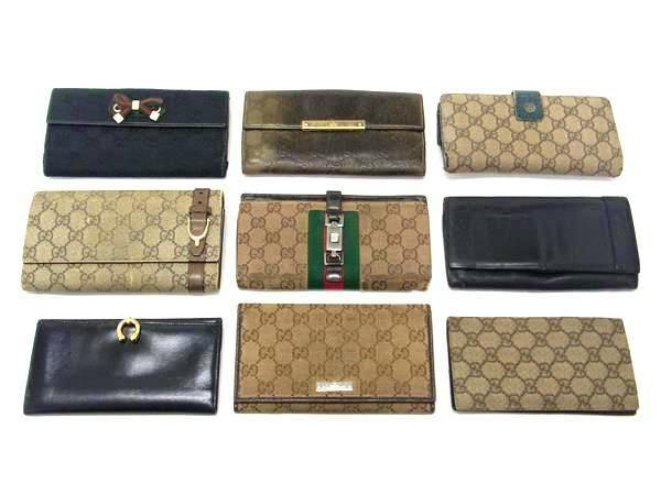 Nine GUCCI wallets and purses arranged in three rows on a white background.