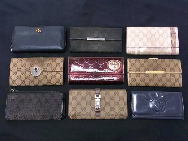 Nine GUCCI wallets, including GG-patterned and leather styles, arranged in three rows on a black background.