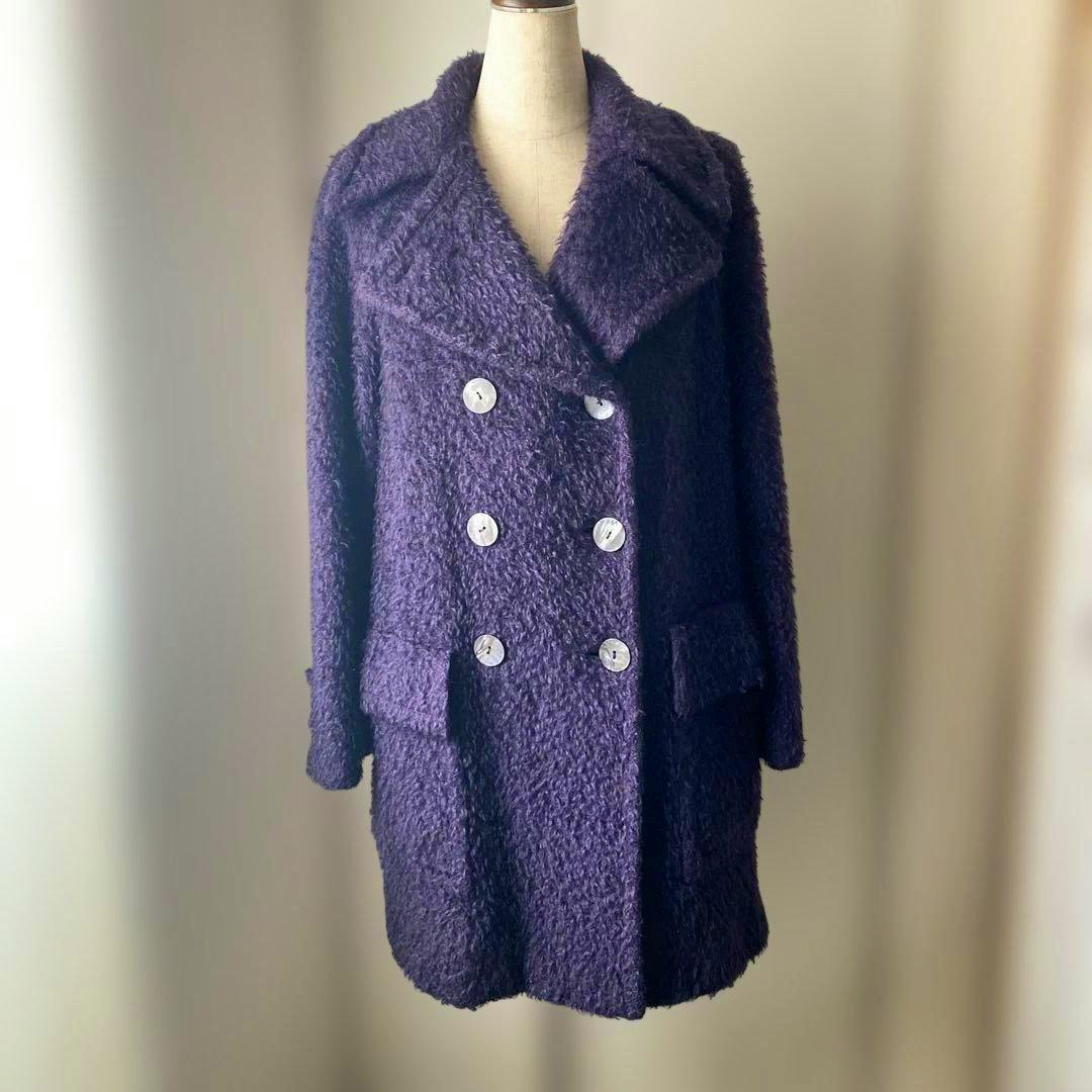 Gucci purple mohair double-breasted coat displayed on a mannequin, front view.