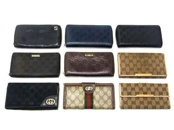 Nine GUCCI wallets laid out in three rows showing various GG patterns and colors.
