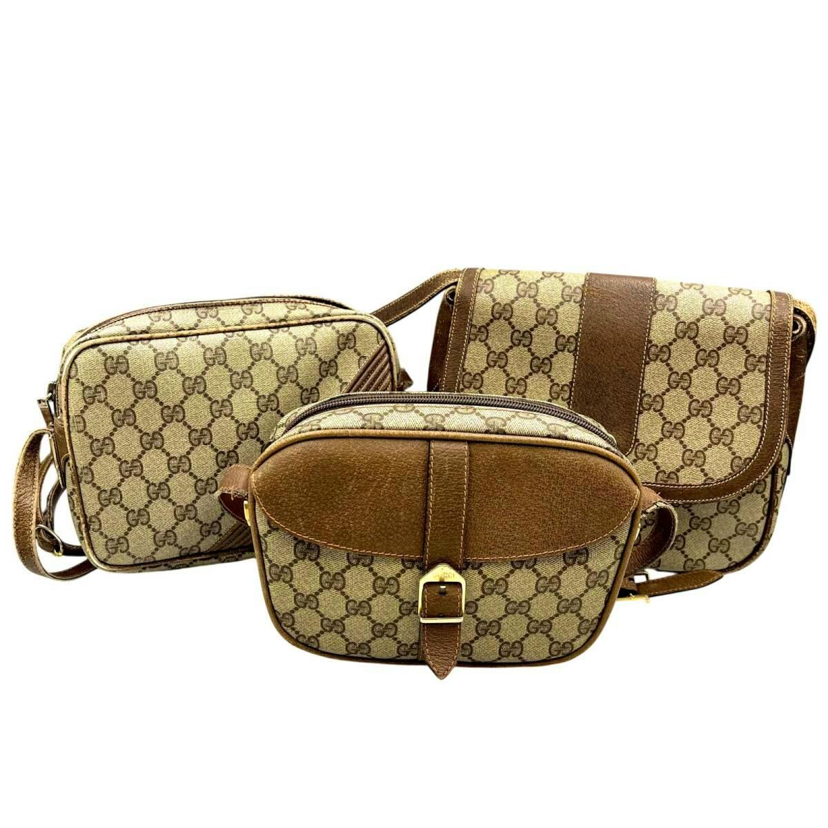 Three Gucci GG Supreme canvas shoulder bags with brown leather trim arranged together, front view.