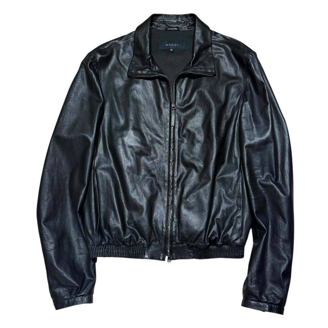 Black GUCCI men's cow leather jacket laid flat showing the front zipper and collar.