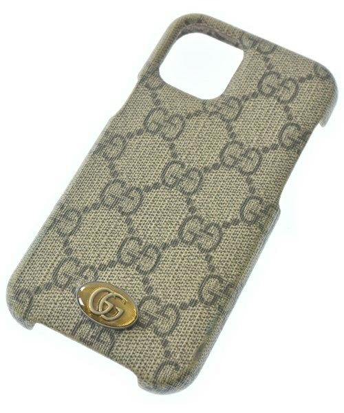 Beige Gucci monogram fabric phone case with a gold double-G emblem.