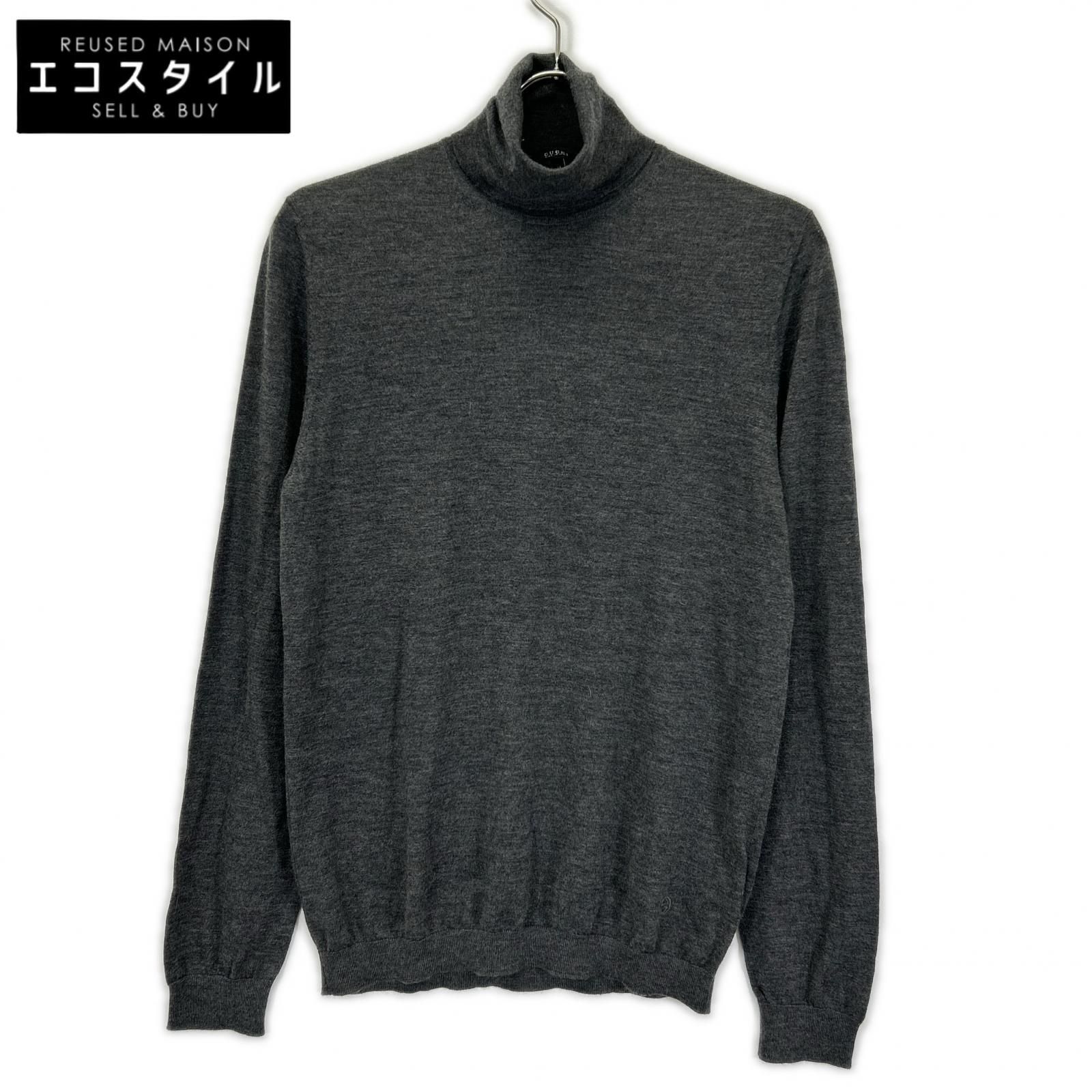 Charcoal GUCCI turtleneck long-sleeve wool sweater on a hanger against a white background.