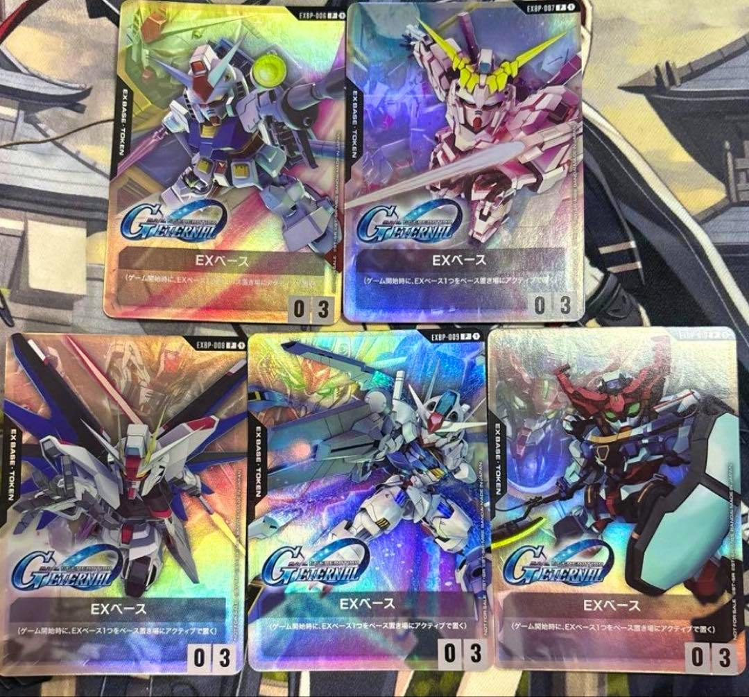 Six holographic EXベース (EX Base) trading cards from the Gundam Card Game G Generation collaboration set arranged on a playmat.