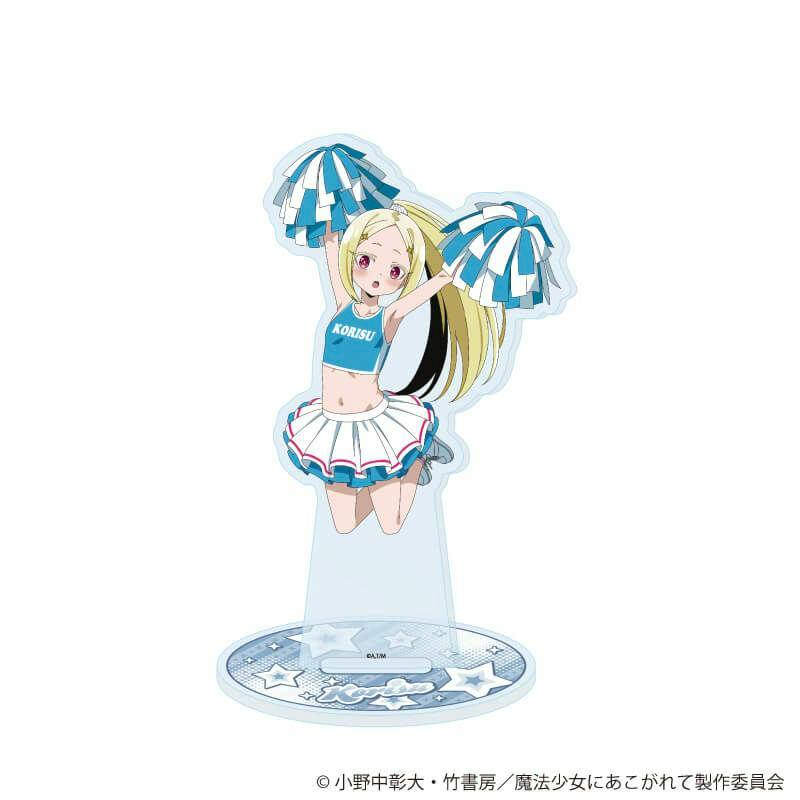 An acrylic stand showing the illustrated character in a blue cheerleader outfit holding pom-poms on a round decorative base.