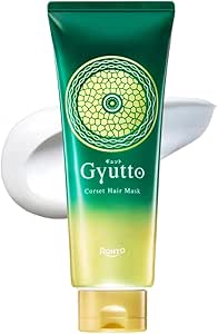 Front-facing tube of Gyutto Corset Hair Mask with a smear of white hair mask behind it.