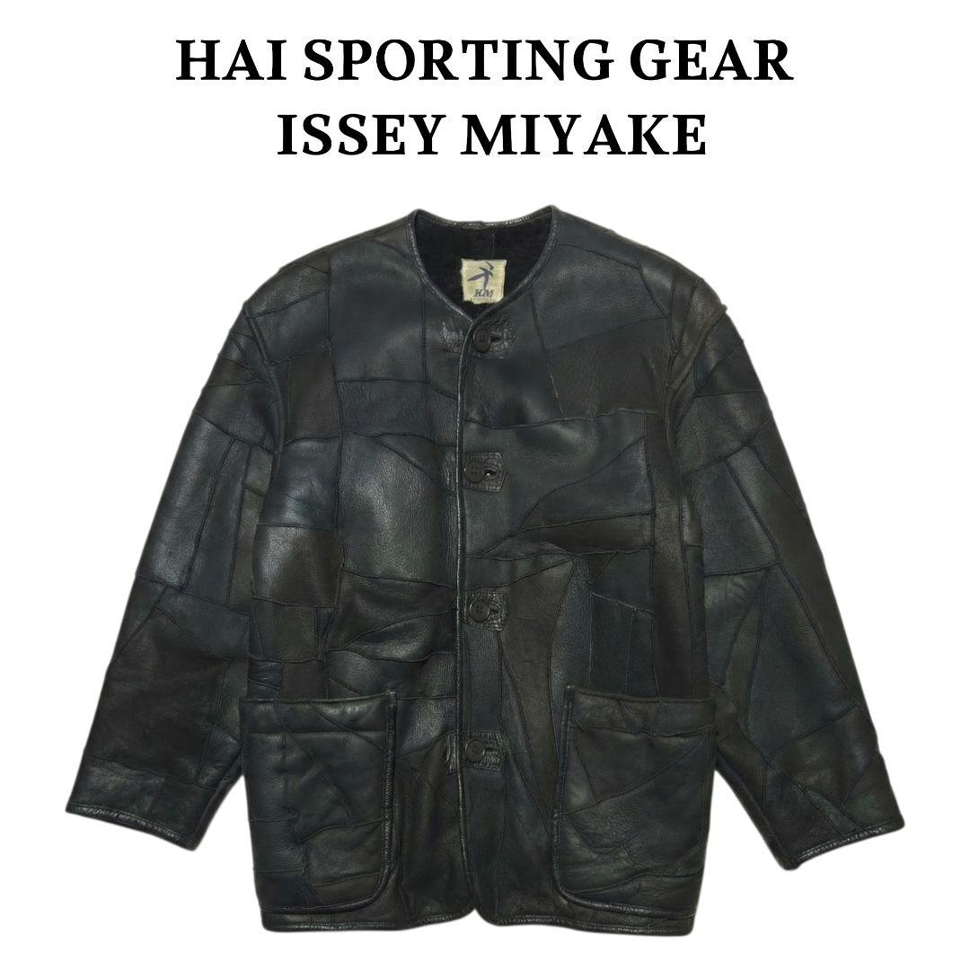 Front view of the HAI SPORTING GEAR ISSEY MIYAKE patchwork lambskin leather jacket with button closure and two front pockets.