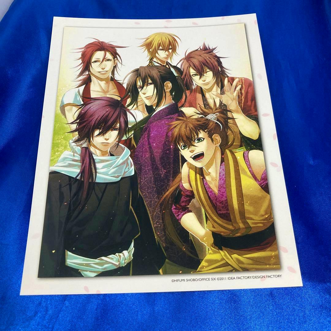 A Hakuouki art print showing six anime characters on a white‑bordered sheet photographed on blue fabric.
