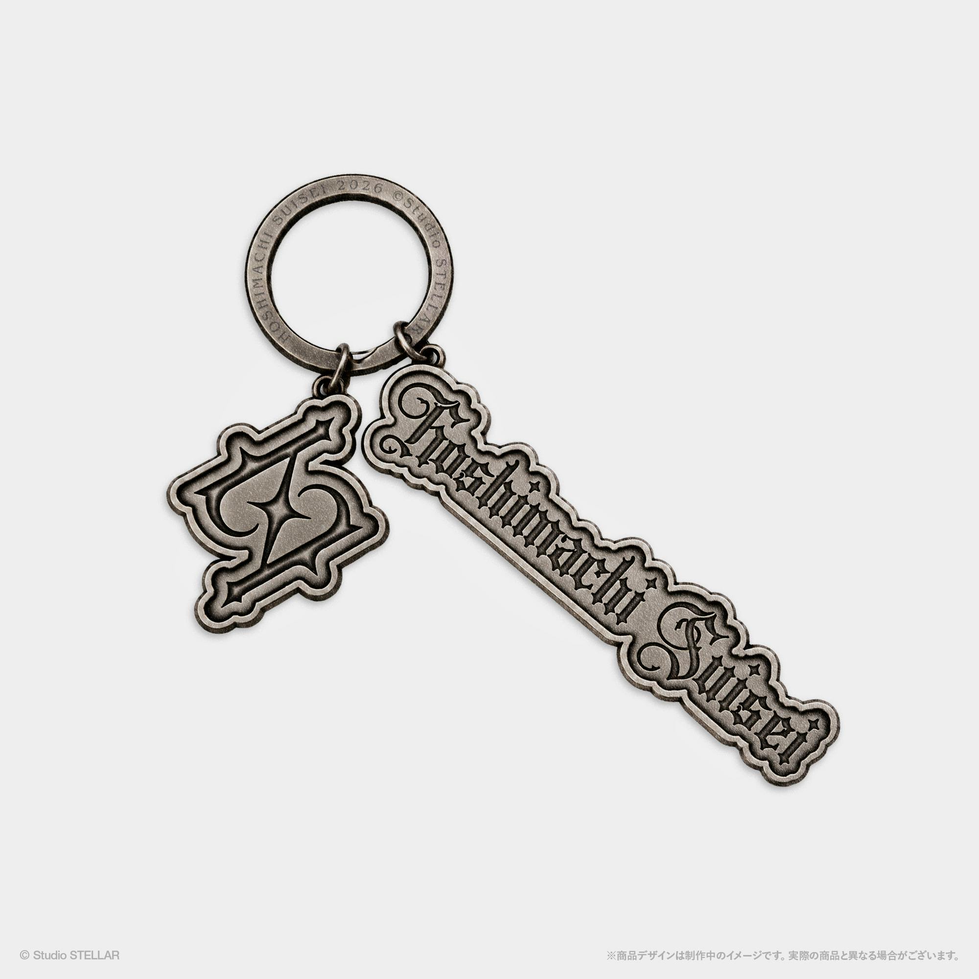 Close-up of a metal keychain showing the circular key ring and attached zinc-alloy charms, one with the word "Halloween" in decorative script.