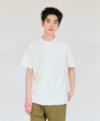 Male model wearing a white men's crew neck T-shirt against a plain light background.