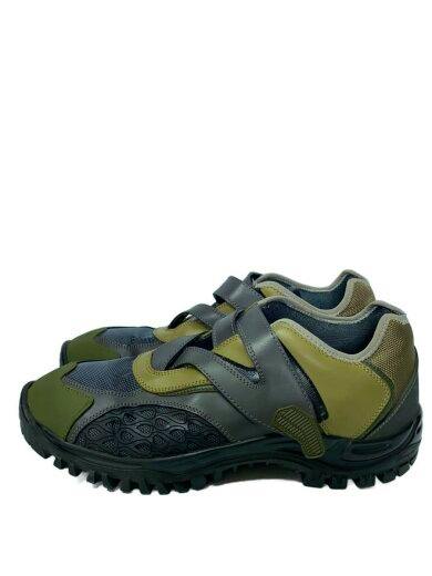 Side view of olive-green low-cut HARKMAN sneakers with black rugged soles and velcro straps.
