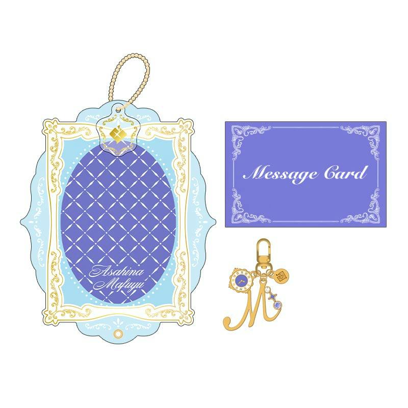 Illustration of the keychain gift set for プロセカ バースデーギフトシリーズ2026 Luminous Celebration 朝比奈 まふゆ, showing an acrylic frame keychain, a gold 'M' charm, and a message card.