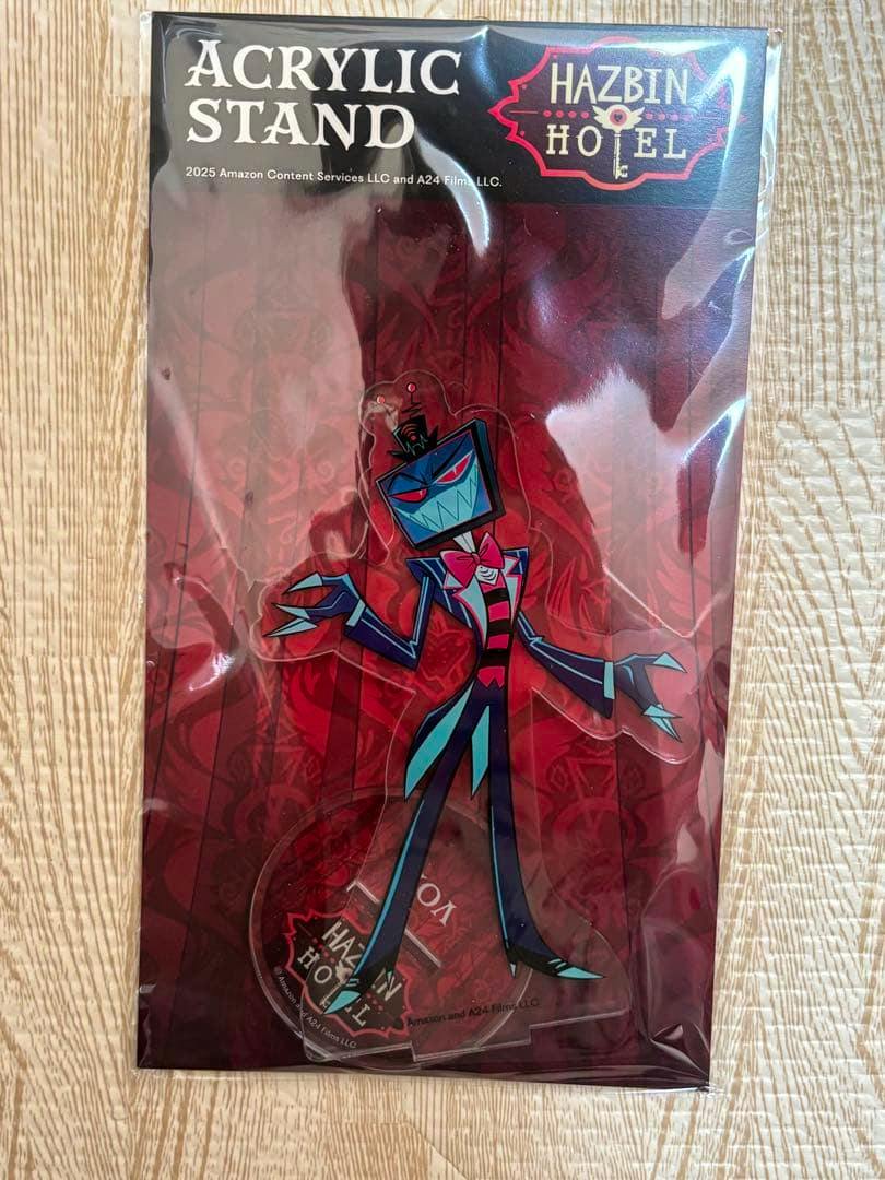 Packaged Hazbin Hotel Vox acrylic stand showing the character figure on a red backing card.