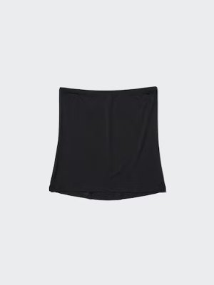 Black Heattech belly warmer laid flat on a light background.
