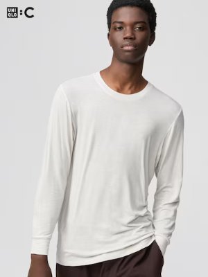 Male model wearing a white crew-neck long-sleeve Heattech cashmere-blend T-shirt.