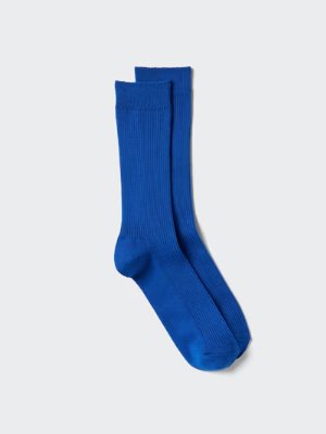 A pair of blue ribbed men's socks laid flat on a light background.