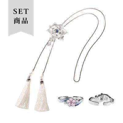 Choker and ring set: white tassel choker with a flower-shaped pendant and two matching rings on a white background.