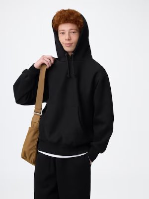 A model wearing the men's heavyweight long-sleeve hooded sweatshirt (parka) in black.
