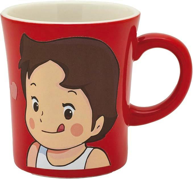 Red ceramic mug featuring a cartoon Heidi girl's face on the front with a handle on the right.