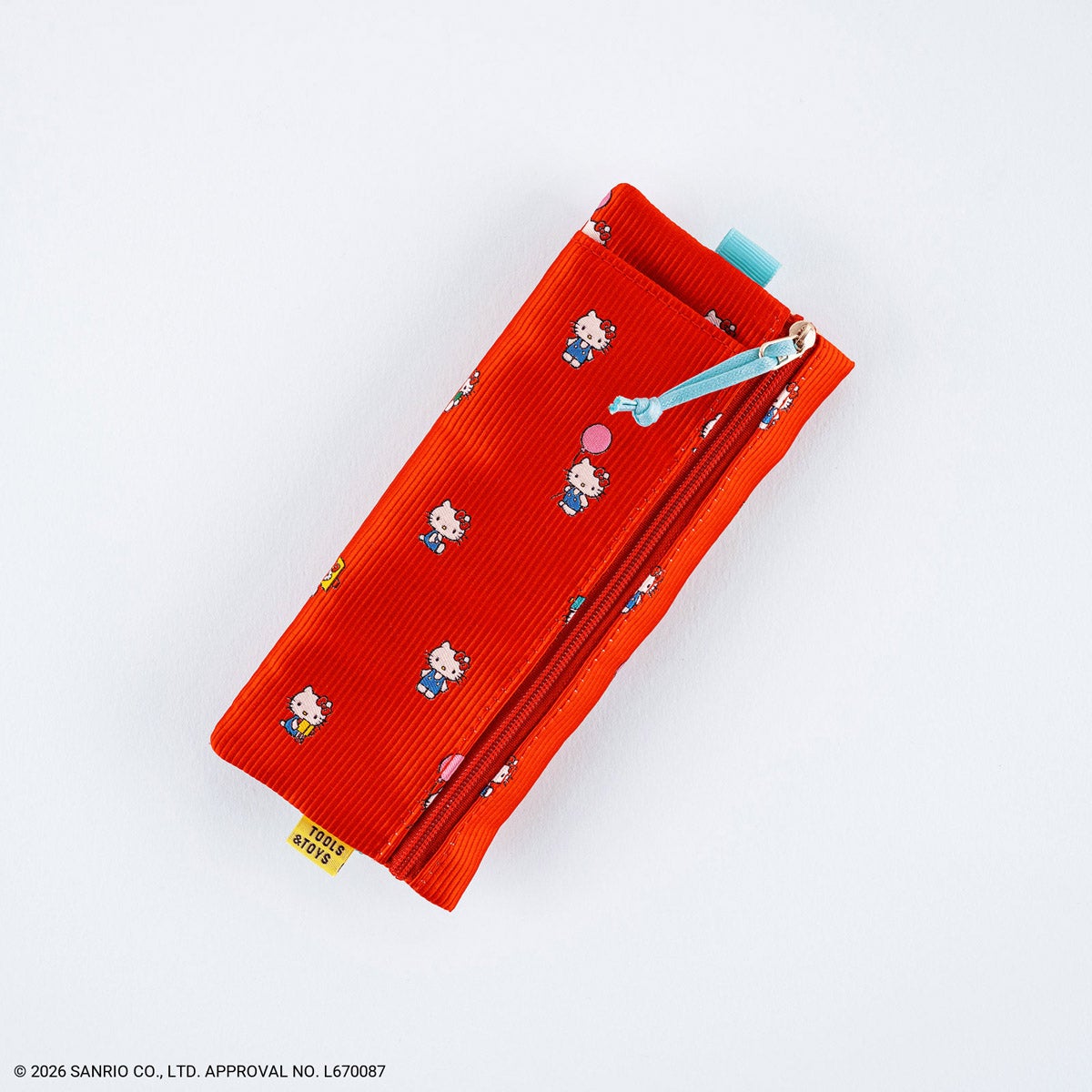 Red HELLO KITTY flat pen case with small Hello Kitty motifs and a blue zipper pull on a white background.