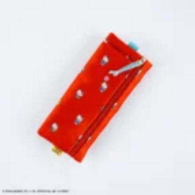 Top-down photo of the flat Hello Kitty pencil case on a white background.