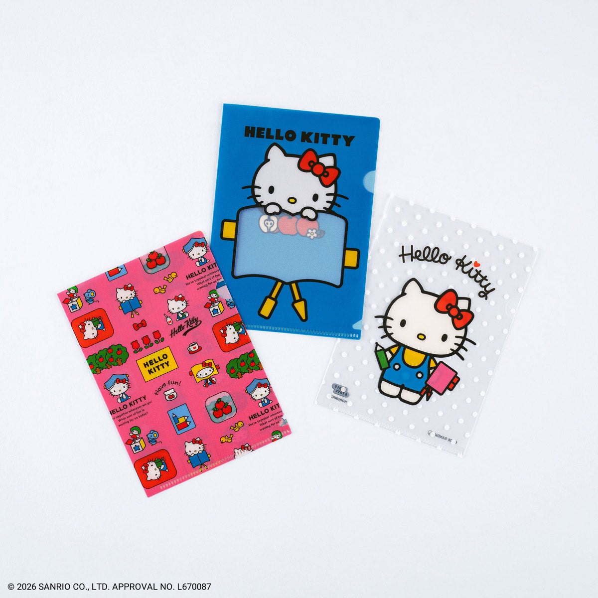 Three Hello Kitty Hobonichi A6 clear file folders with different printed designs displayed on a white background.