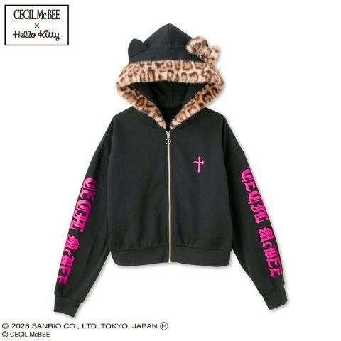 Front view of the women's hood-fur foil-print zip parka (Hello Kitty × CECIL McBEE) in black with a fur-lined hood and pink sleeve prints.