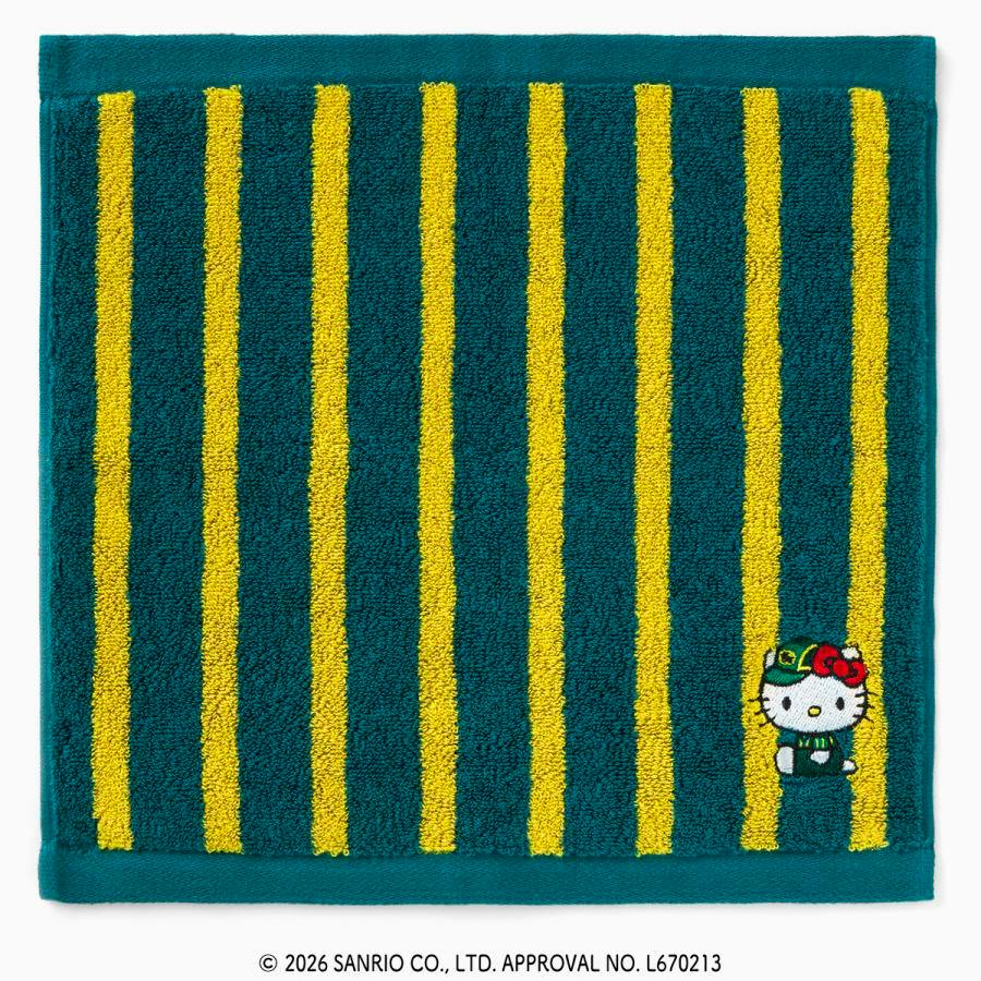 Green hand towel with yellow vertical stripes and a small Hello Kitty embroidery in the lower right corner.