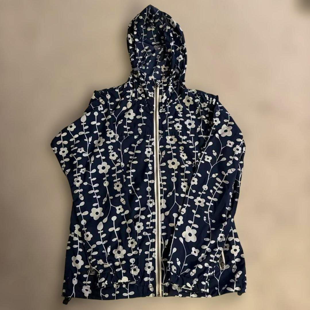 Navy HELLY HANSEN hooded floral-patterned zip-up parka laid flat showing the front.