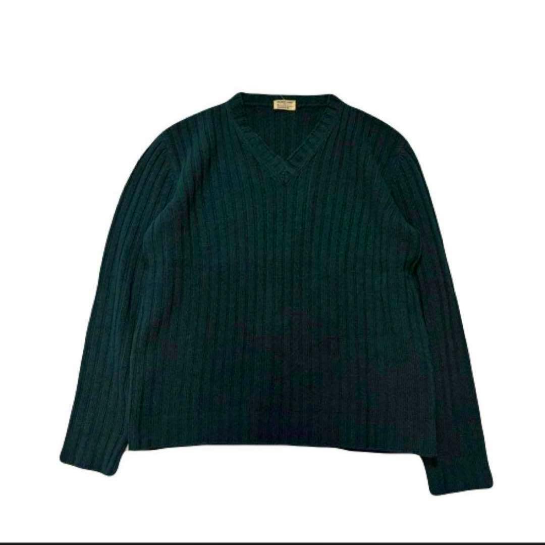 Dark green ribbed V-neck knit sweater laid flat on a white background.