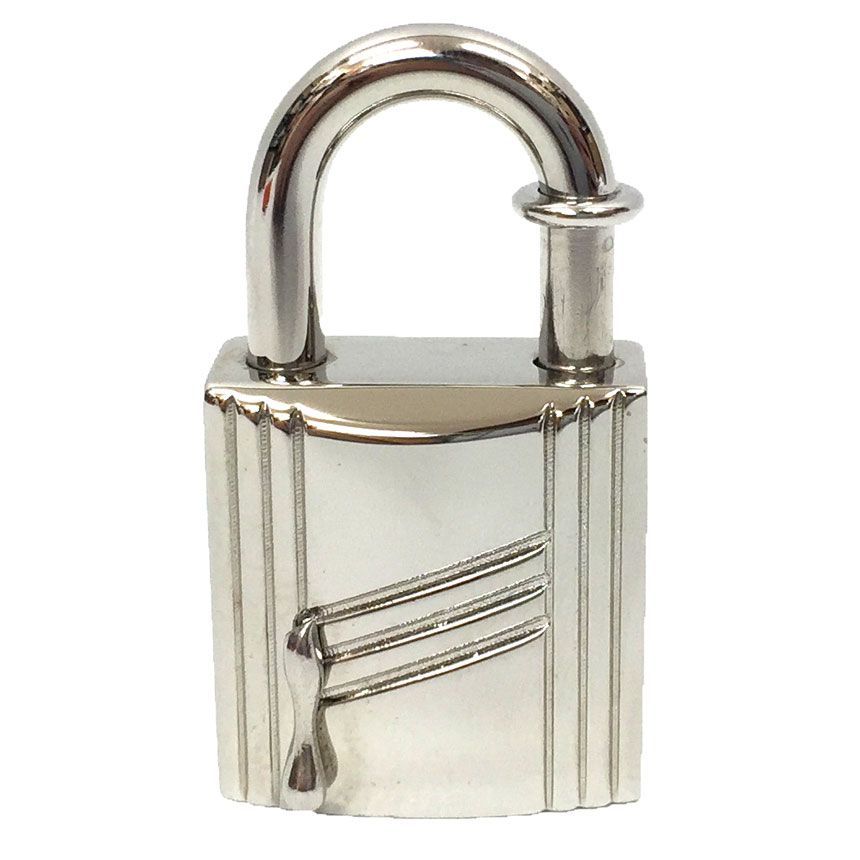 Front view of a silver padlock pendant top (Hermès Cadena/Anne Arbre) showing a dripping motif on the front.