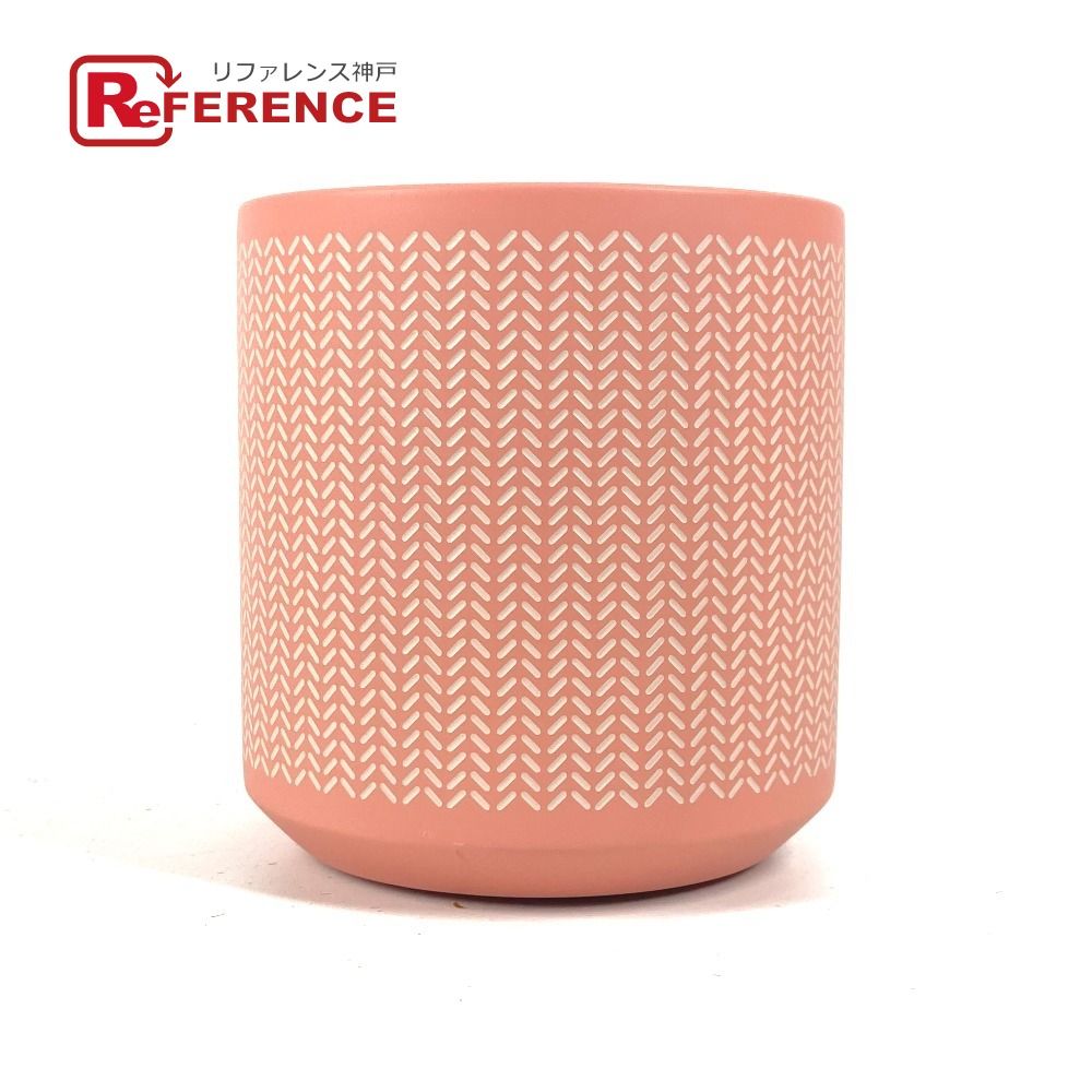 Pink wooden small storage box (Hermes boudoir caddy) with a white repeating chevron pattern on a white background.