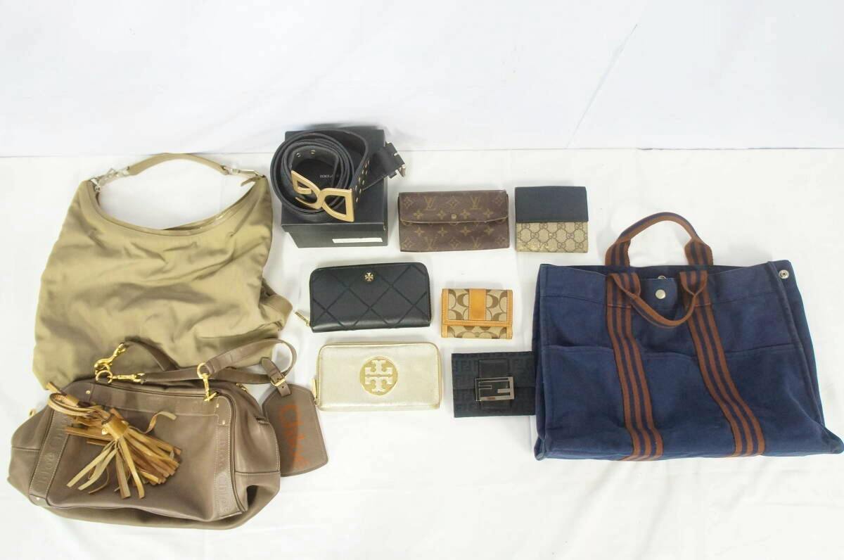 Assorted branded bags, wallets, and belts arranged on a white background for a bulk set.