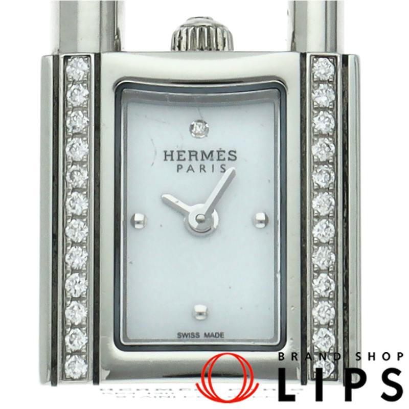 Close-up of the watch face and diamond-set bezel showing the Hermès Paris logo.