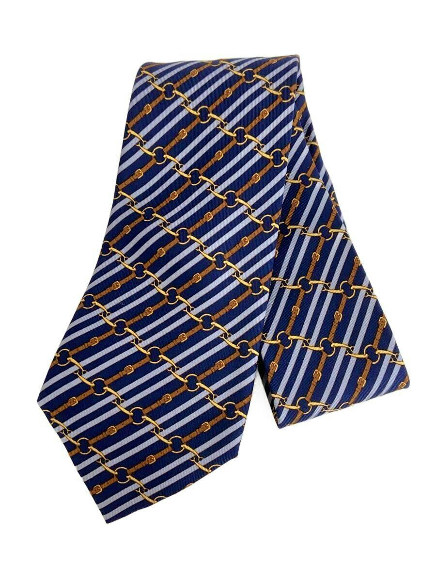 Blue HERMES men's necktie (polyester) with diagonal light-blue stripes and a gold chain pattern shown flat.