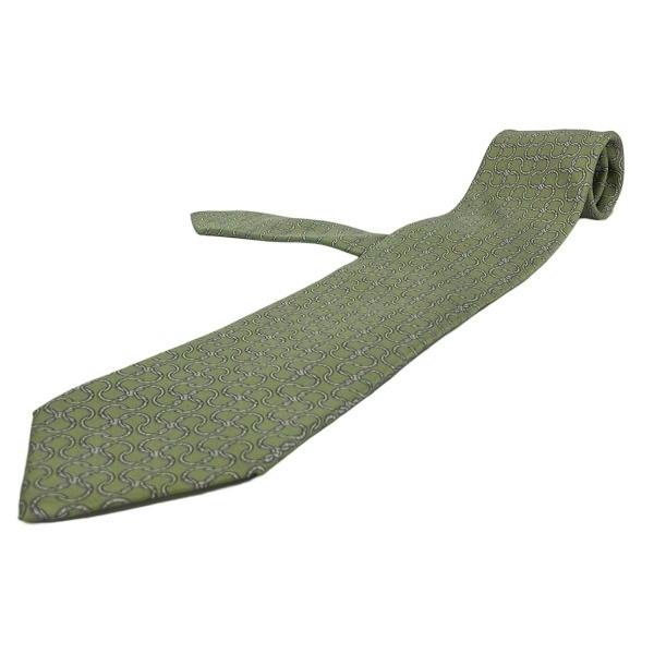 A light-green and light-gray patterned men's silk necktie laid flat on a white background.