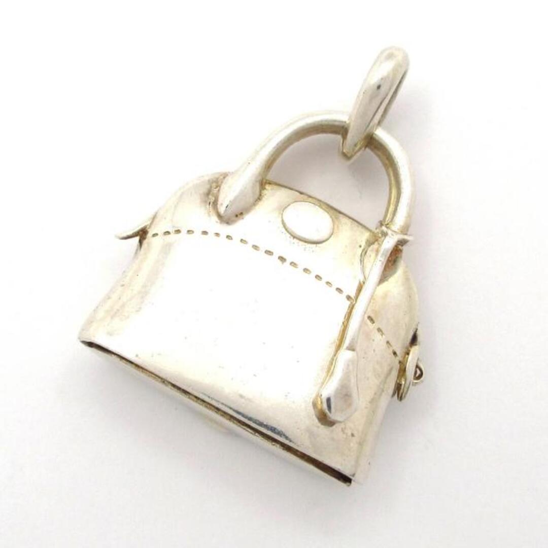 Front view of a silver handbag-shaped pendant top with a loop for attaching to a chain.