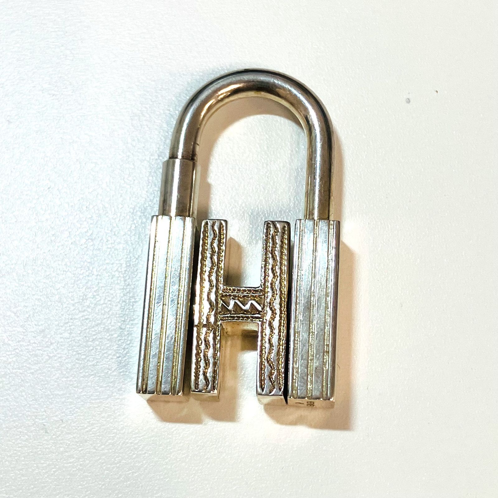 Silver HERMES Touareg Cadena padlock (SILVER925) photographed on a white background.